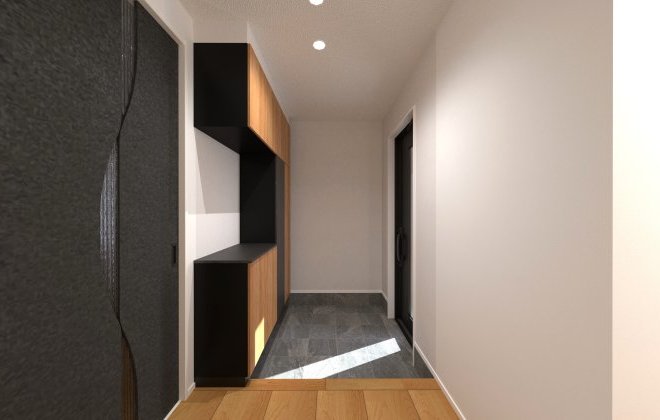 木目とブラックを組み合わせたスタイリッシュな玄関収納が印象的。壁面いっぱいに設けた収納は靴や日用品をすっきりしまえる大容量で、いつでも整った美しい玄関空間を保てます。※画像はイメージパースです
